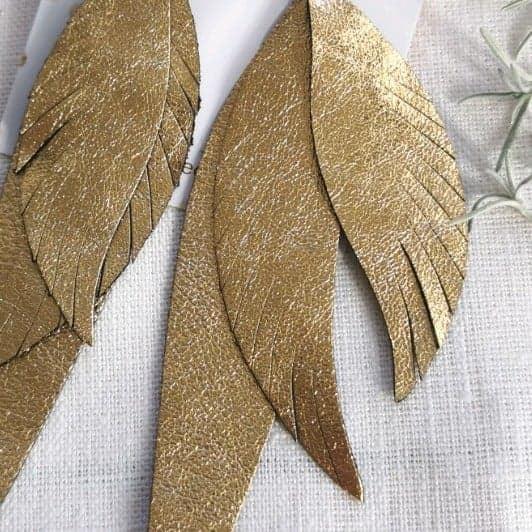 LEMPI earrings, Wings 2.0. (gold, leather)