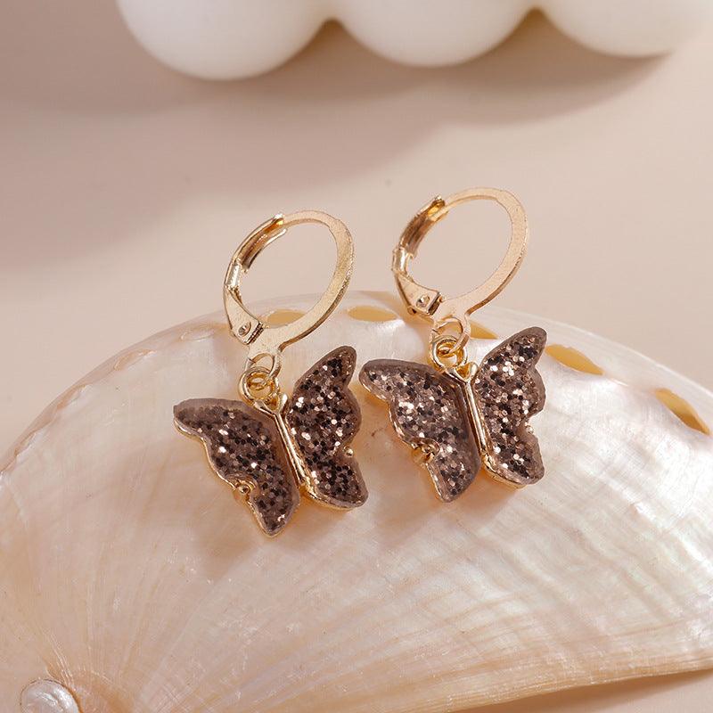 FRENCH RIVIERA | Mandy -glitter butterfly earrings (brown)